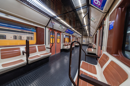 MADRID, SPAIN - APRIL 13, 2019: Inside empty Metro wagons on Line 9, an unusual sight for this type of transport. The Metro of Madrid is usually much busier during rush hour.