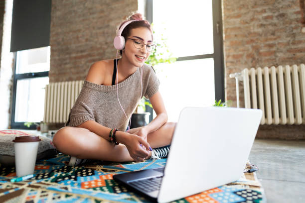 istock Young woman working from her cozy apartment 1217044048