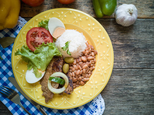 Traditional Brazilian food dish. Beans, rice, meat and salad.