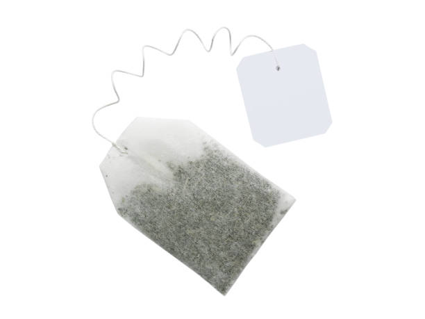 istock Tea bag on spiral string with blank tag isolated o 1217046606