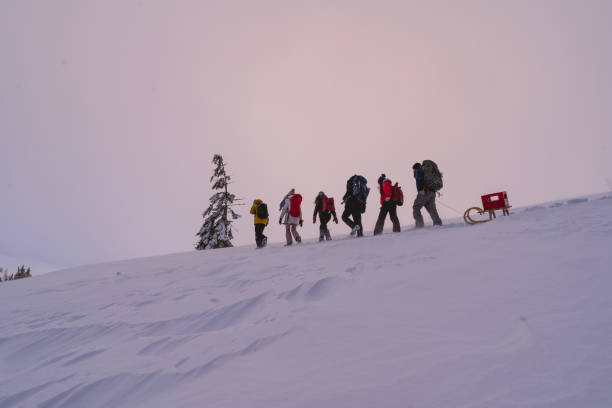 istock Friends hike through snow at dusk 1217048481