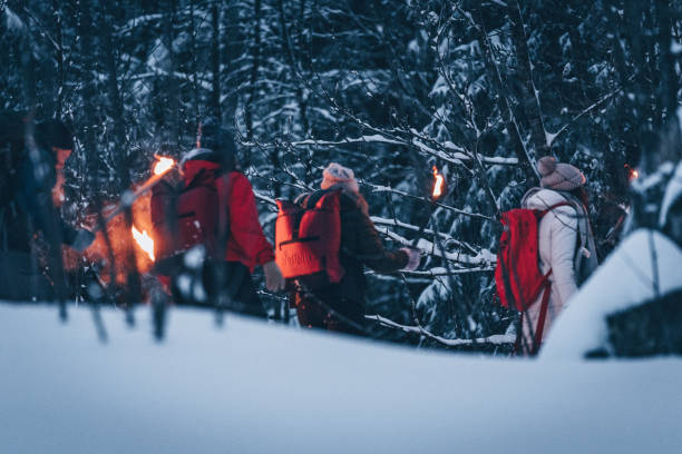 istock Friends hike through snow at dusk 1217048709