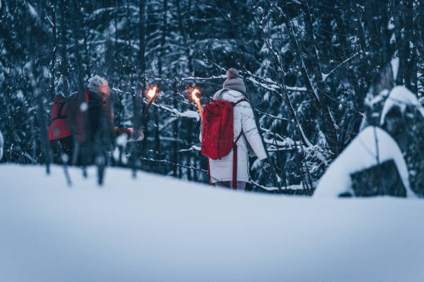 istock Friends hike through snow at dusk 1217048795