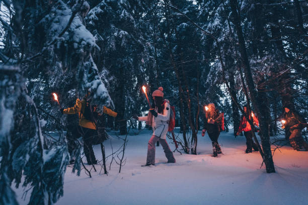 istock Friends hike through snow at dusk 1217048799