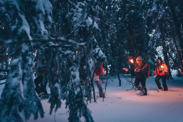 istock Friends hike through snow at dusk 1217048802