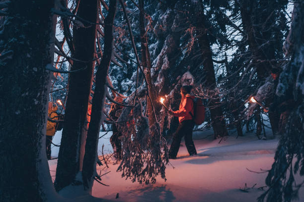 istock Friends hike through snow at dusk 1217048872