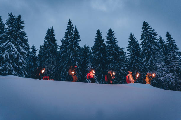 istock Friends hike in line through snow 1217049593
