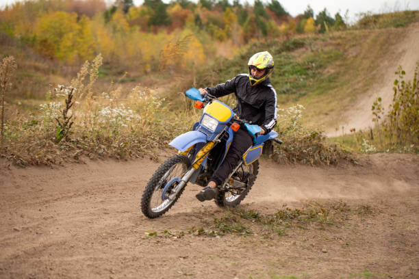 istock Motocross athlete driving on a dirt road 1217051535