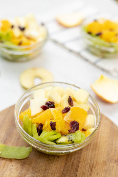 istock Fruit salad with kiwi orange and apple in the bowl 1217051739