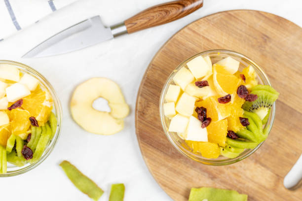 istock Fruit salad whipped cream flat lay white marble table 1217051789
