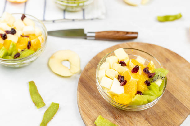 Fruit salad whipped cream flat lay white marble table