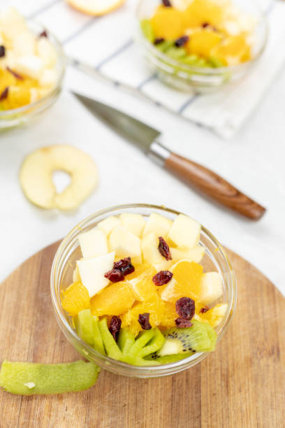 istock Fruit salad with kiwi orange and apple in the bowl 1217051828