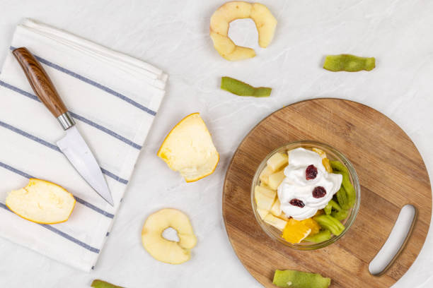 istock Fruit salad whipped cream flat lay white marble table 1217051867