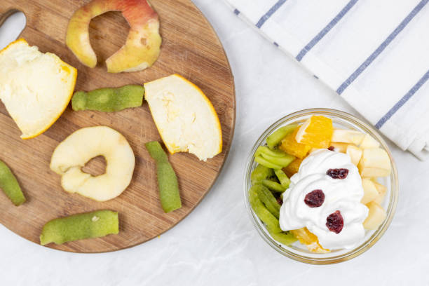 istock Fruit salad whipped cream flat lay white marble table 1217051881