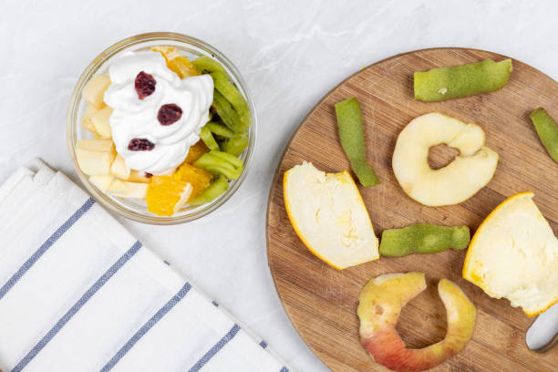 istock Fruit salad whipped cream flat lay white marble table 1217051889