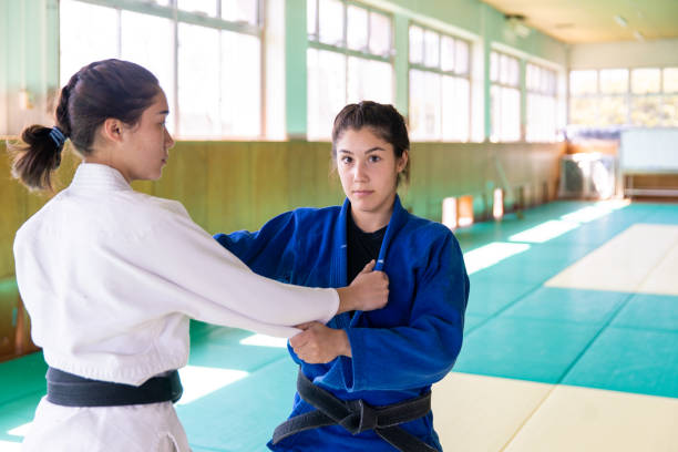 istock Young female Jodo athletes practicing in Dojo 1217052837