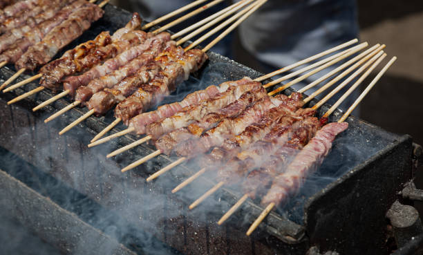 Arrosticini, cooked outdoors.