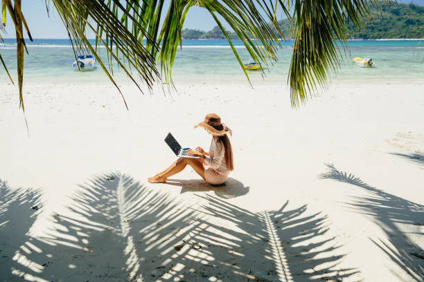 Woman freelancer on the beach