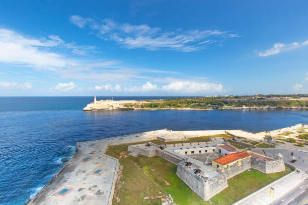 Famous Morro Castle (Castillo de los Tres Reyes del Morro), a fortress guarding the entrance to Havana bay in Havana, Cuba Famous Morro Castle (Castillo de los Tres Reyes del Morro), a fortress guarding the entrance to Havana bay in Havana, Cuba havana harbor photos stock pictures, royalty-free photos & images