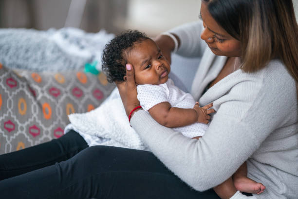 istock Young mother caring for baby 1217055940
