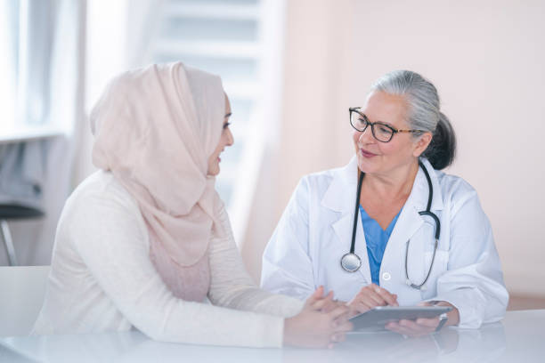 istock Female doctor consulting patient 1217055963