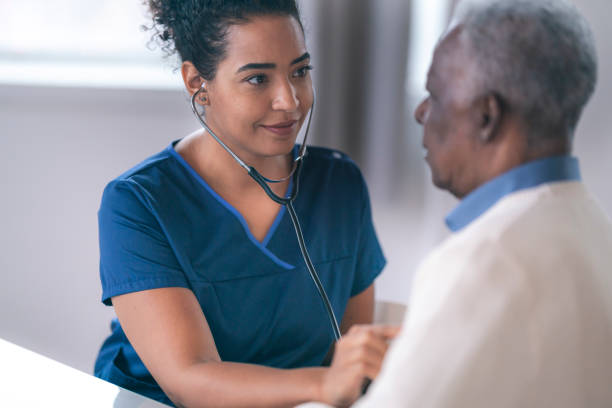 istock Female doctor performing routine exam on senior patient 1217055989