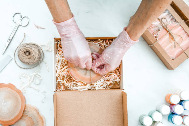 istock Creativity and craft. A young girl creates coasters from resin. Gift wrapping. Decorative packaging. Idea for business. Remote work, work at home. Art coasters. 1217056322
