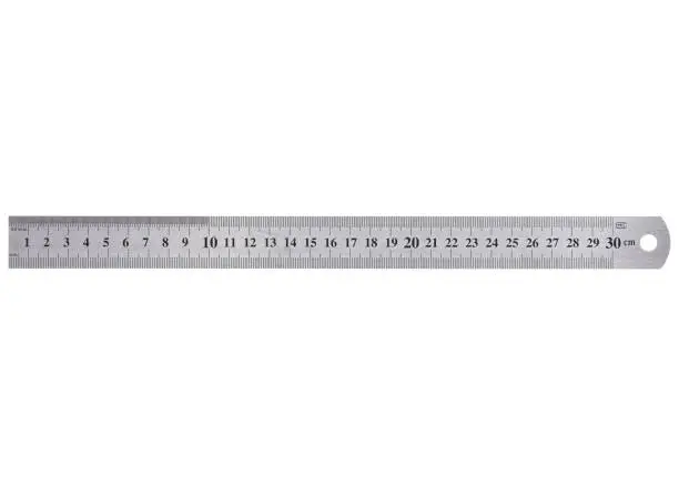 A metal ruler with a scale of up to 30 centimeters is isolated on a white background.