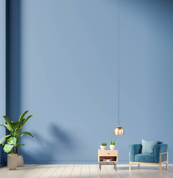 istock The interior has a armchair on empty dark blue wall background. 1217059152