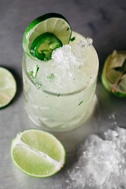 istock Summer alcoholic cocktail  with crushed ice garnished with limes 1217064993