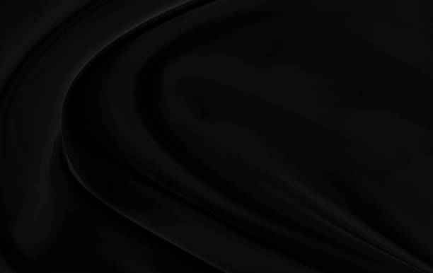 istock Black gray satin dark fabric texture luxurious shiny that is abstract silk cloth background with patterns soft waves blur beautiful. 1217070824
