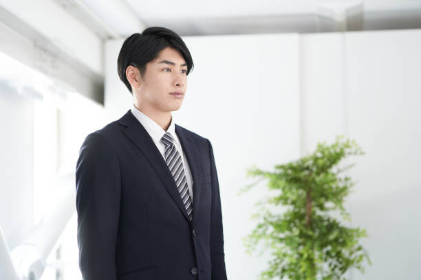 A Japanese Male Businessman Stock Photo - Download Image Now - 20