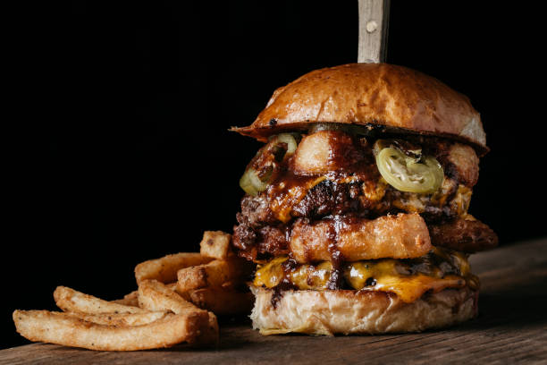 istock Juicy Burger with onion rings and pickled jalapenos 1217073762