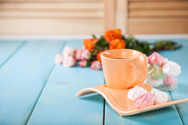 istock Romantic breakfast - zephyr, tea and roses on a table. Selective focus. Copy space. 1217075966