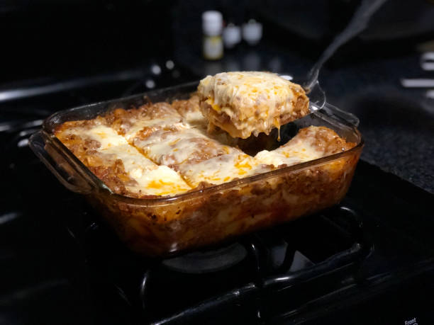istock Lasagna in glass dish with spatula 1217076854
