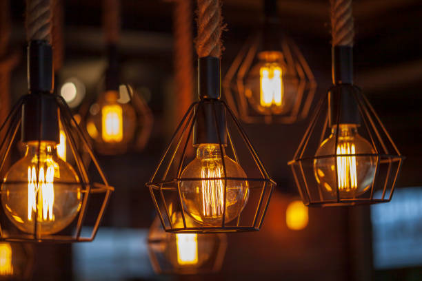 istock antique lanterns, Decorative antique edison style light bulbs, on dark background 1217081333