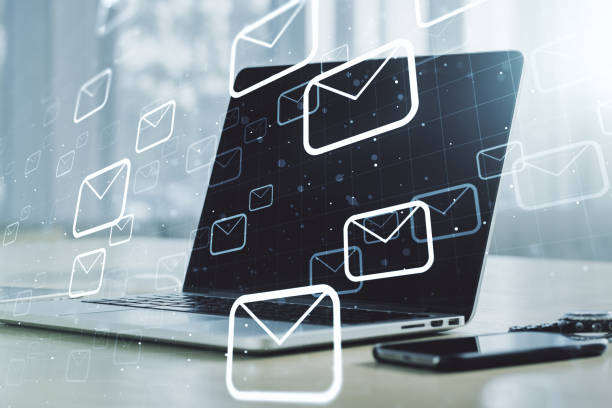 istock Creative abstract postal envelopes sketch on modern laptop background, e-mail and marketing concept. Double exposure 1217082959