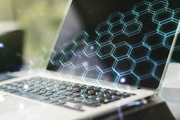 istock Creative concept of wireless technology with hexagon hologram on modern laptop background. Big data and database concept. Multiexposure 1217082966