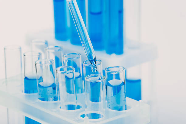 istock Laboratory glassware with a dropper dripping liquid into a test tube. scientific laboratory test tubes, laboratory equipment 1217084090