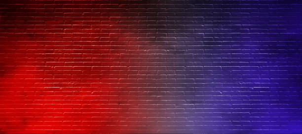 istock Studio dark room with lighting effect red and blue on black brick wall gradient background for interior decoration. 1217084299