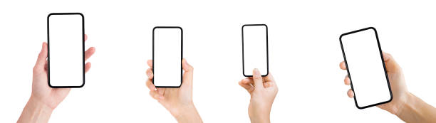 istock Hand holding old black smartphone isolated on white background. 1217085030