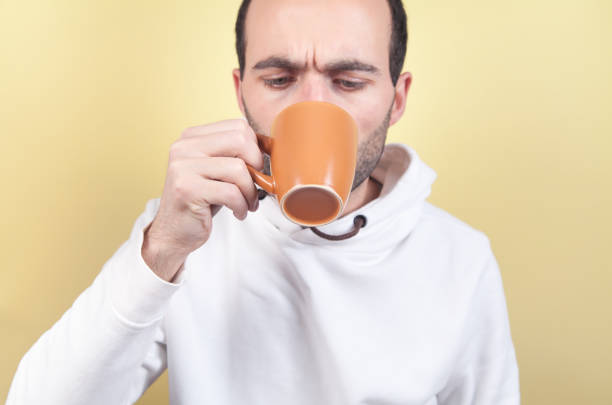 istock Caucasian man drinking tea at home. 1217086077