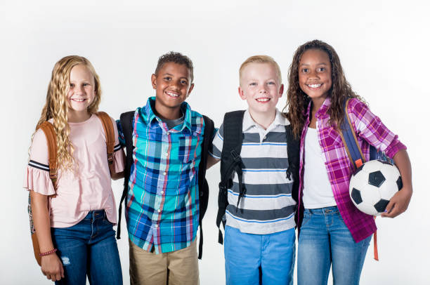 istock Portrait of a Group of smiling elementary school students with backpacks 1217088719
