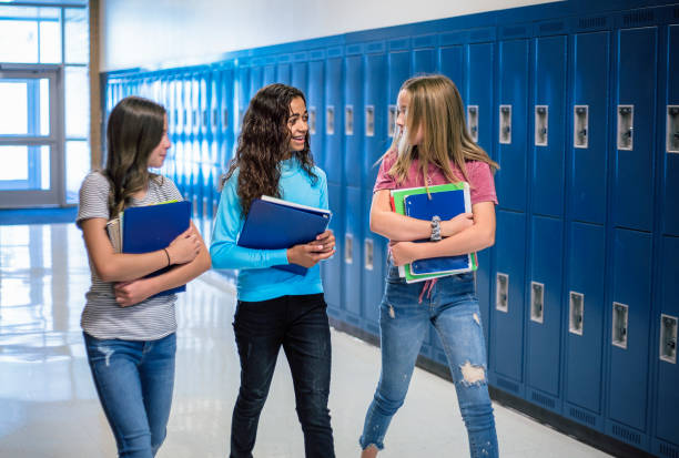 istock Junior High school Students talking and walking in the hallway in a junior high school 1217089306
