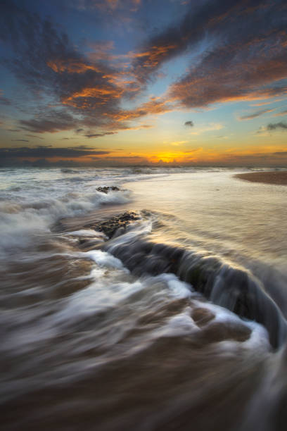 istock Sea waves hitting the rock 1217090801