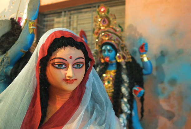 Kali idols in making, at Kalighat Patuapara Clay model of Smt. Sarada Devi, wife and spiritual consort of Sri Ramakrishna Paramhansa, a 19th century Hindu mystic & sage. An idol of Goddess Kali is seen in back. Sarada Devi used to worship Kali.
Kali puja is an Indian festival, the most popular religious festival after Durga puja in eastern India, particularly in West Bengal. Photo taken on the day before Kali Puja festival in Kolkata on 10/26/2019. kali statue stock pictures, royalty-free photos & images