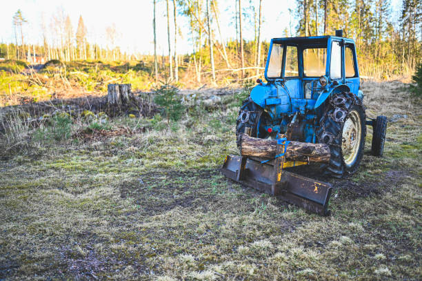 istock old blue tractor with plow waiting for snow 1217091717