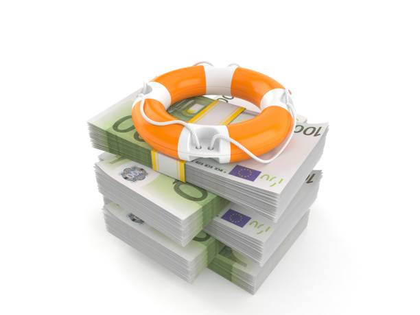 istock Life buoy on stack of money 1217092597