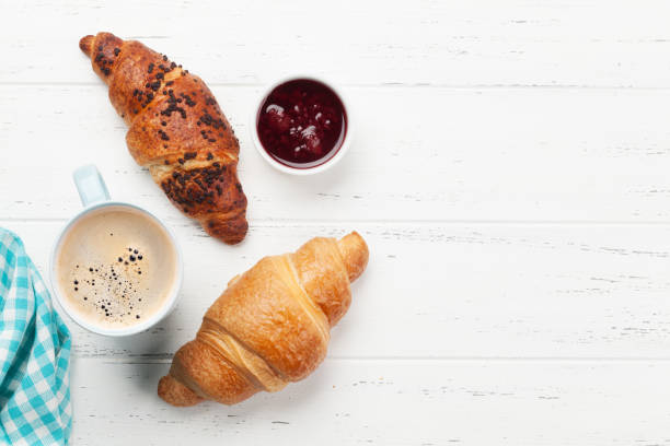 istock Breakfast with coffee and croissants 1217093512
