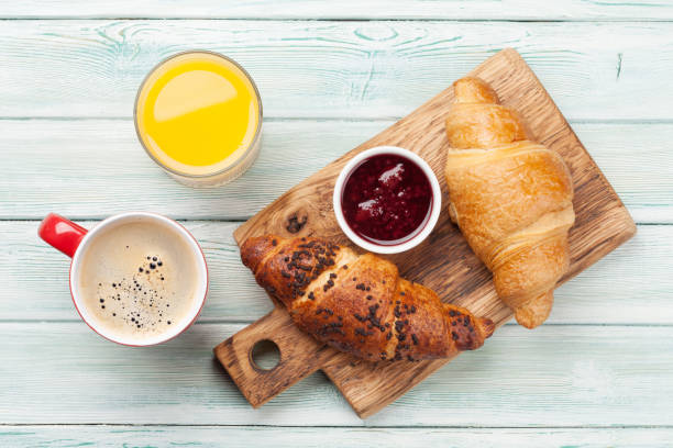 istock Breakfast with coffee and croissants 1217093544